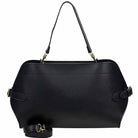 Black handbag with gold accents on a white background