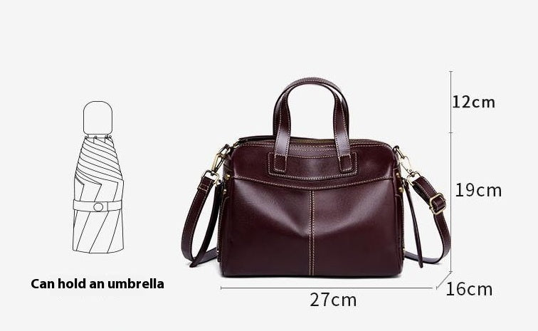 Brown leather handbag with dimensions labeled on a white background