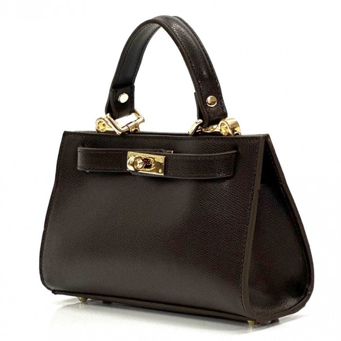 Black handbag with gold hardware on a white background