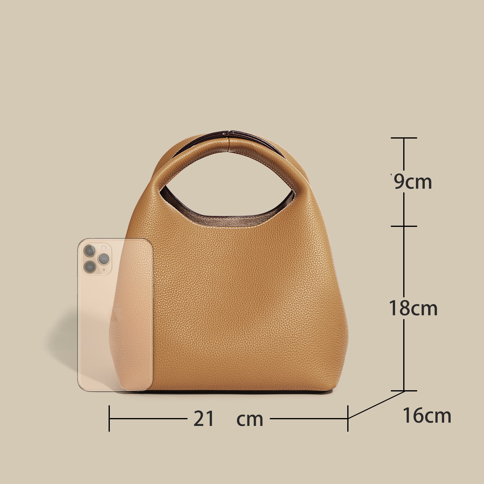 Tan handbag with dimensions labeled on a beige background
