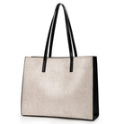 Beige handbag with black handles on a white background
