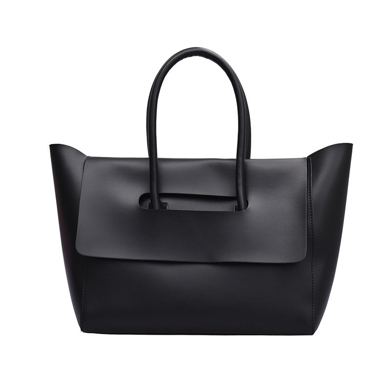 Black handbag on a white background