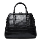 Black crocodile-patterned handbag on a white background