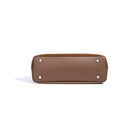 Brown handbag with silver studs on a white background