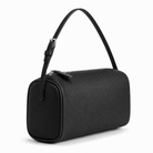 A black pebbled leather cylindrical shoulder bag with a single top handle and a zippered top closure, shown on a plain white background.